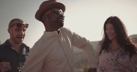 Friends dancing and having fun on mountain cottage patio party Stock Footage 83458144