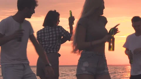 Friends dancing on the beach. Stock Footage 95760401