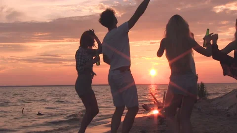 Friends dancing on the beach Stock Footage 95760444