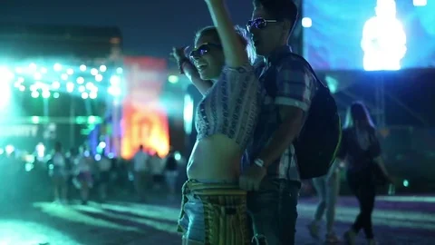 Friends dancing at festival outdoors Stock Footage