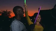 Friends Dancing With Glowsticks At A Party On A Rooftop Stock Footage