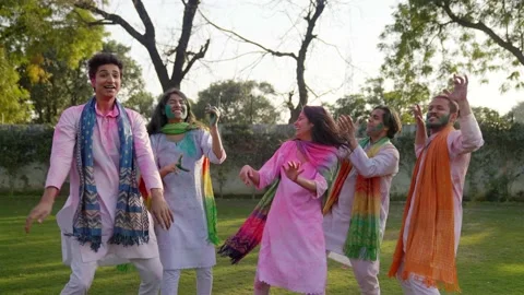 Friends dancing at a Holi party Stock Footage 230179547