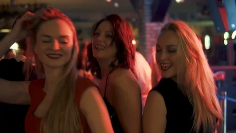 Friends dancing at a party. two young women famously dance at a concert Stock Footage 102130712
