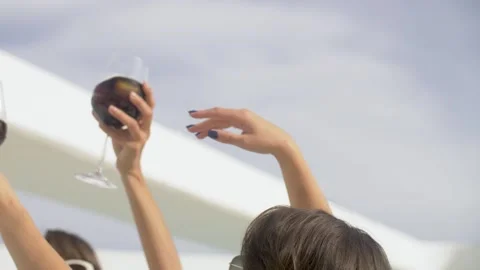 Friends dancing at pool party, clinking glasses with cocktails  swimming pool. Stock Footage 274710422