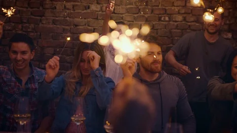 Friends dancing with sparklers Stock Footage 95324279