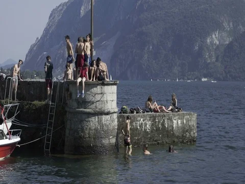 Friends Diving into a Lake Video stock 78071829