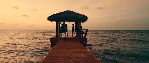 Friends on dock at sunset 動画素材 84330579