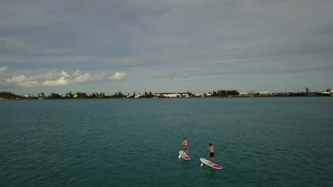 Friends doing stand up paddle in Bermudas Stock Footage 85572867
