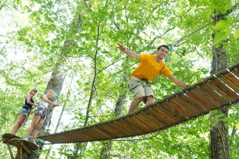 Friends doing a trail on the threes Stock Photos