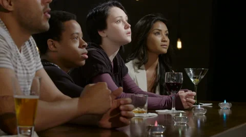 Friends drinking and cheering at a bar Stock Footage 62687296