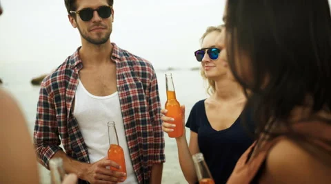 Friends drinking on the beach Stock Footage 68796558