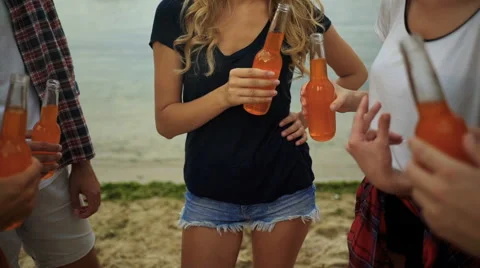 Friends drinking beer on the beach Stock Footage 68799864