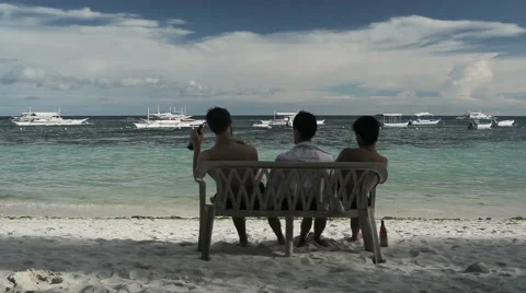 Friends drinking beer on the shore Stock Footage 49023255