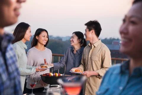 Friends Drinking on Rooftop Stock Photos