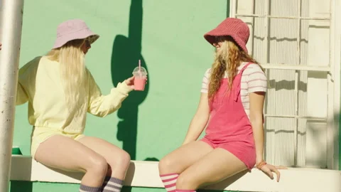 Friends Drinking while sitting on the wall Stock Footage 279379262