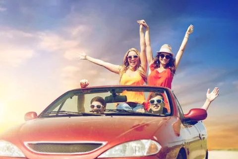 Friends driving in convertible car at country Stock Photos