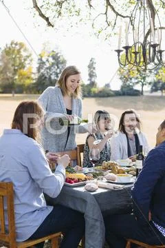 Friends Eating At Outdoor Table