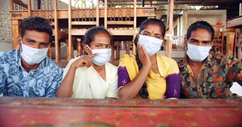 Friends in an empty bar restarant cafe with face masks Stock Footage 145117163