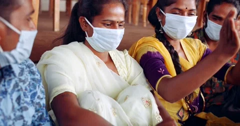 Friends in an empty bar restarant cafe with face masks Stock Footage 145117594