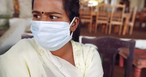 Friends in an empty bar restarant cafe with face masks Stock Footage 145117630