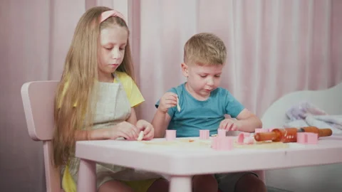 Friends Engrossed in Baking Activity and Creating Shapes Together Video stock 307970775