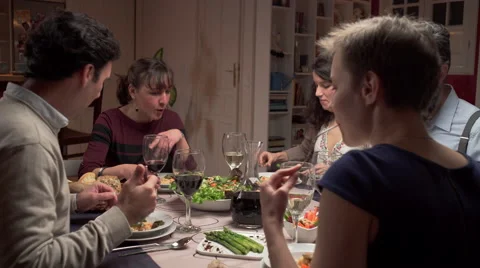 Friends enjoy dinner Видео 46531662