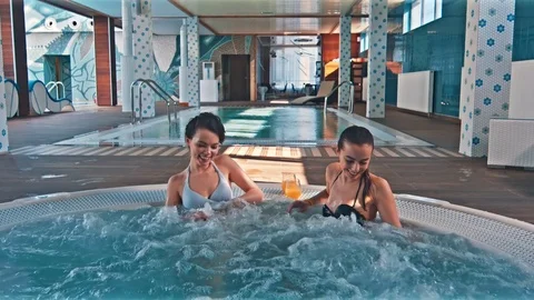 Friends Enjoying In The Jacuzzi Video stock 78417094