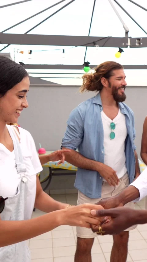 Friends enjoying rooftop party, dancing and celebrating Stock Footage 311801080