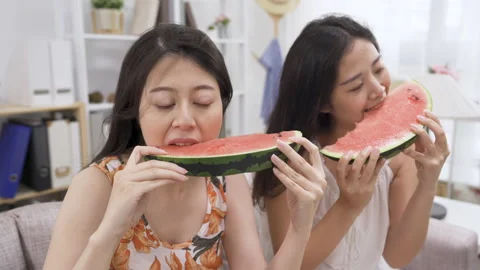 Friends enjoying sharing watermelon Stock Footage 134105138