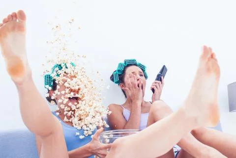 Friends with exploding popcorn Stock Photos