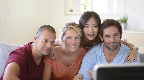 Friends in front of TV watching game Stock Footage