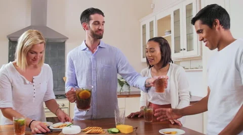 Friends gathering in kitchen Stock Footage 58281249