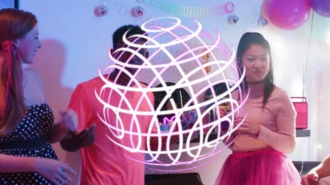 Friends gathering, neon sphere hovering over group then clearing while women Stock Footage 333689129