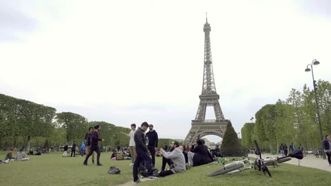 Friends greeting slapping five shaking hands hanging out Eiffel Tower Paris Stock Footage 94000975