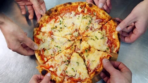 Friends group sharing pizza slices on cutting board table at restaurant Video stock 318310546