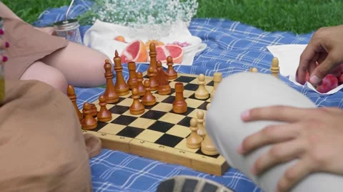 Friends had a picnic and started playing chess in nature in the summer Stock Footage 171824308