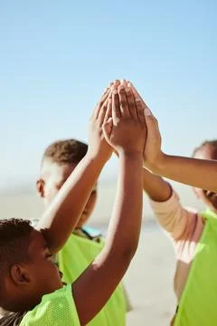 Friends, hands and children high five in support of community, teamwork and Stock Photos