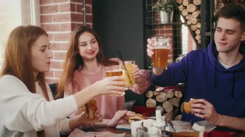 Friends Have Fun in Cafe, Drinking Beverages, Talking. Beautiful Young People Stock-Footage 141740392