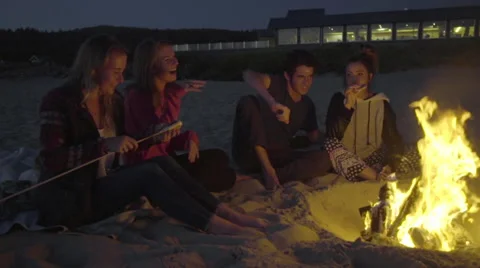 Friends have fun roasting marshmallows Stock Footage 54035442