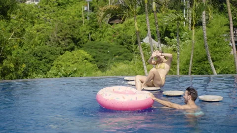 Friends have fun, spend time together on pool party, summer vacation trip Stock Footage 259158201