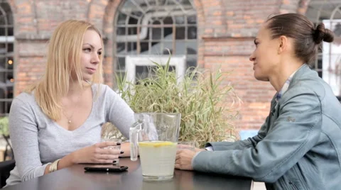 Friends having conversation in cafeteria.FULL HD. Stock Footage 45151569