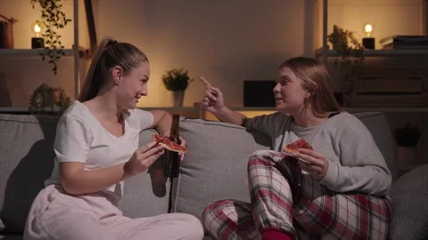 Friends having conversation while eating pizza Stock Footage 241227161