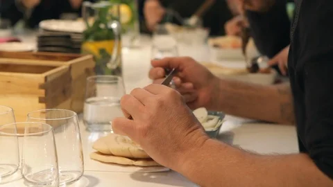 Friends having dinner. Preparing food in the kitchen. Stock Footage 106078320