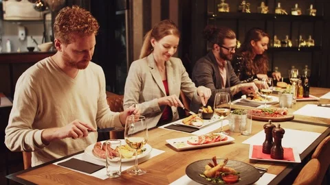 Friends having dinner at restaurant. Stock Footage 125074426