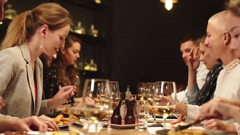 Friends having dinner at restaurant. Stock Footage 125082133