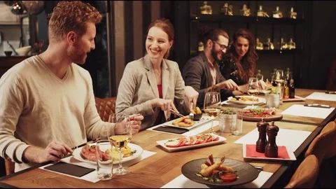 Friends having dinner at restaurant. Stock Footage 125085686