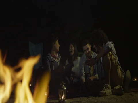 Friends having fun around campfire. Stock Footage 69475475