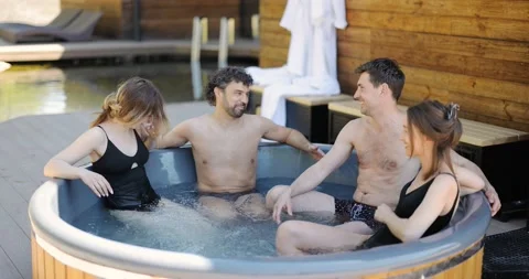 Friends having fun bathing at spa outdoors Stock Footage 154829348