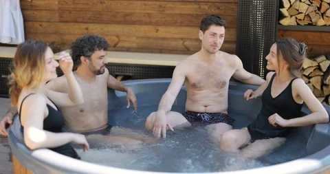 Friends having fun bathing at spa outdoors Stock Footage 154829441