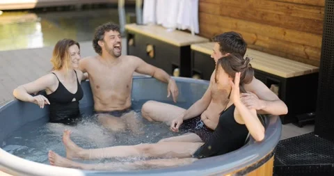 Friends having fun bathing at spa outdoors Stock Footage 154829518